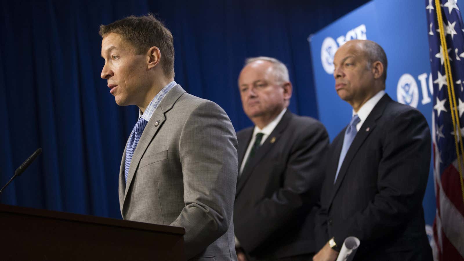 Daniel Ragsdale, left, speaks at a 2014 news conference at the ICE headquarters