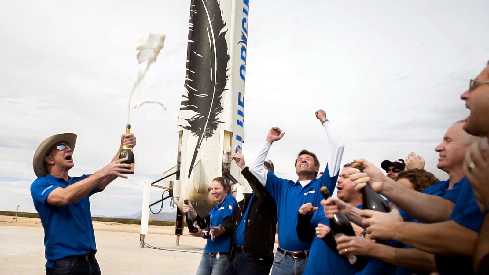 Jeff Bezos and his team celebrate a successful test.