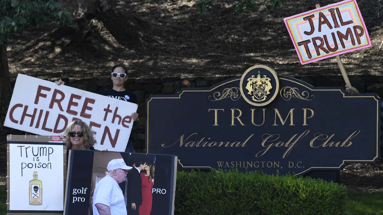 Protesters outside the Trump National Golf Club in Sterling, Virginia, where the gala dinner will be held.