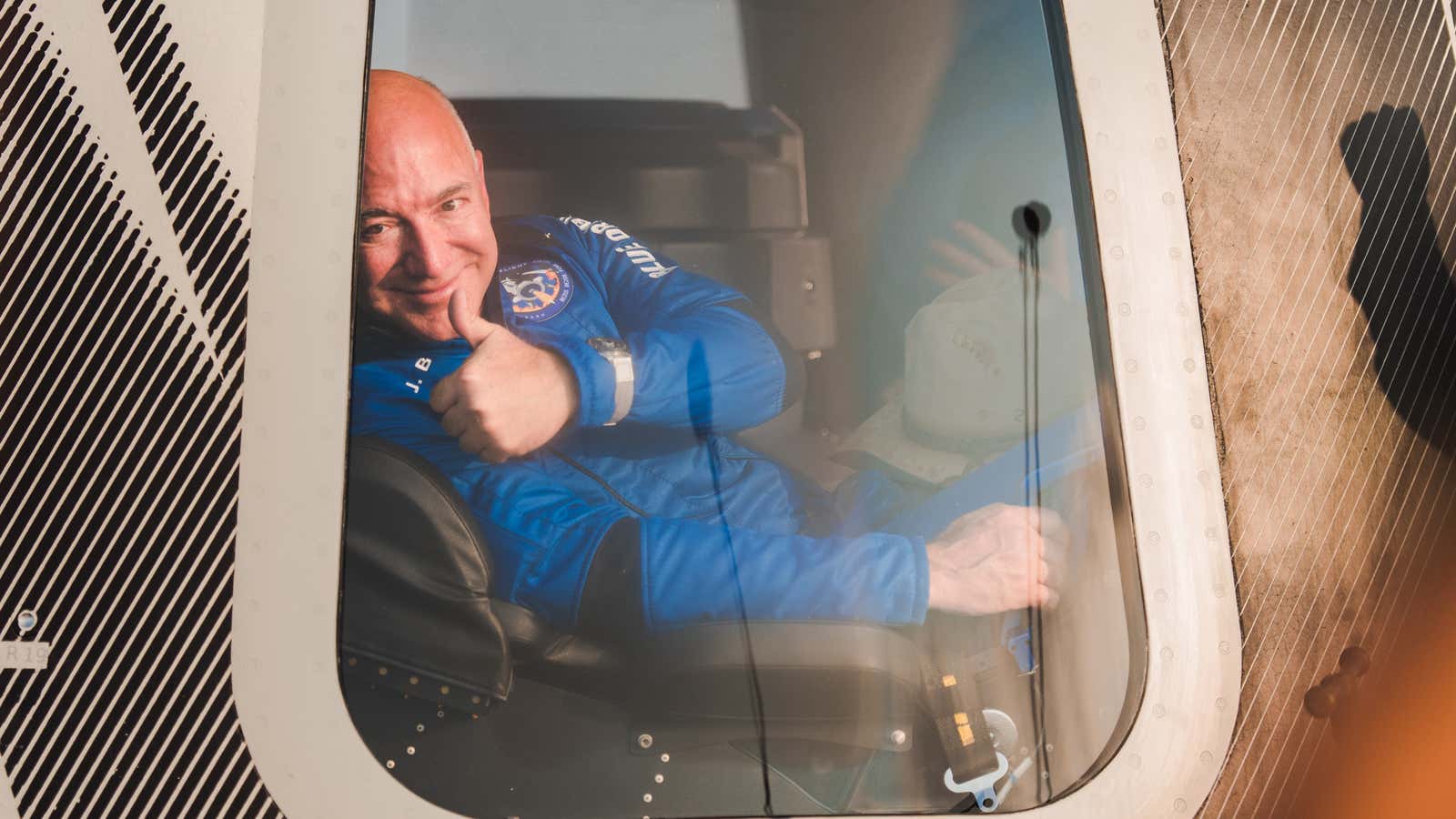 Jeff Bezos is seen inside the New Shepard capsule after returning from the edge of space.