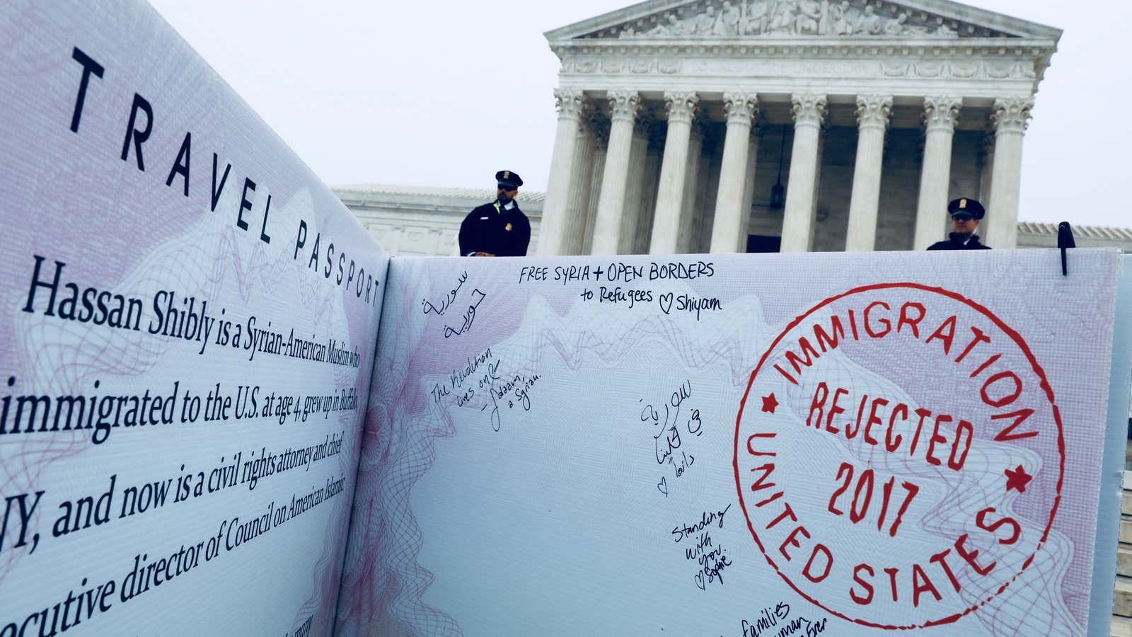 A mock-up of a banned Muslim traveler’s passport outside the US Supreme Court.