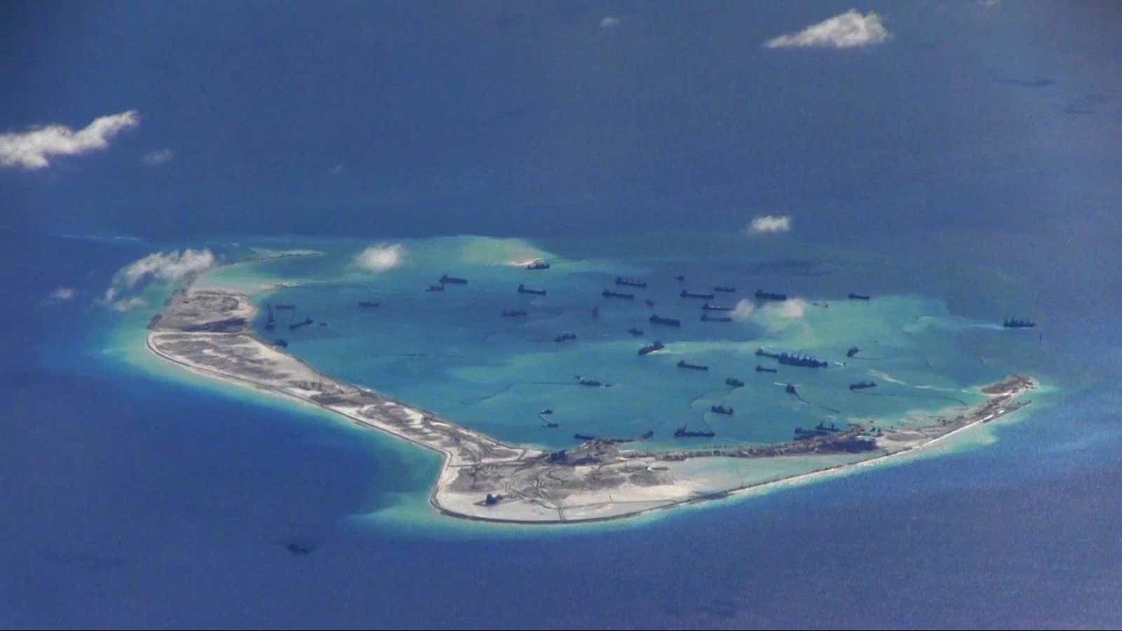 Chinese dredging vessels seen in the waters around Mischief Reef in the disputed Spratly Islands in the South China Sea.