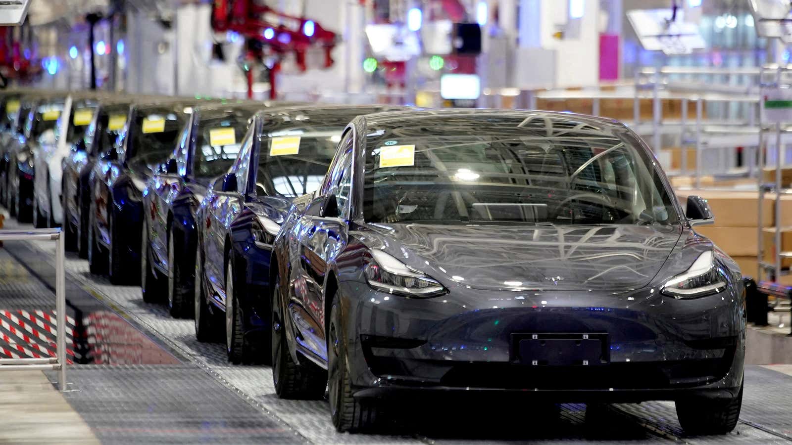 FILE PHOTO: Tesla’s China-made Model 3 vehicles are seen during a delivery event at its factory in Shanghai, China January 7, 2020. REUTERS/Aly Song/File Photo