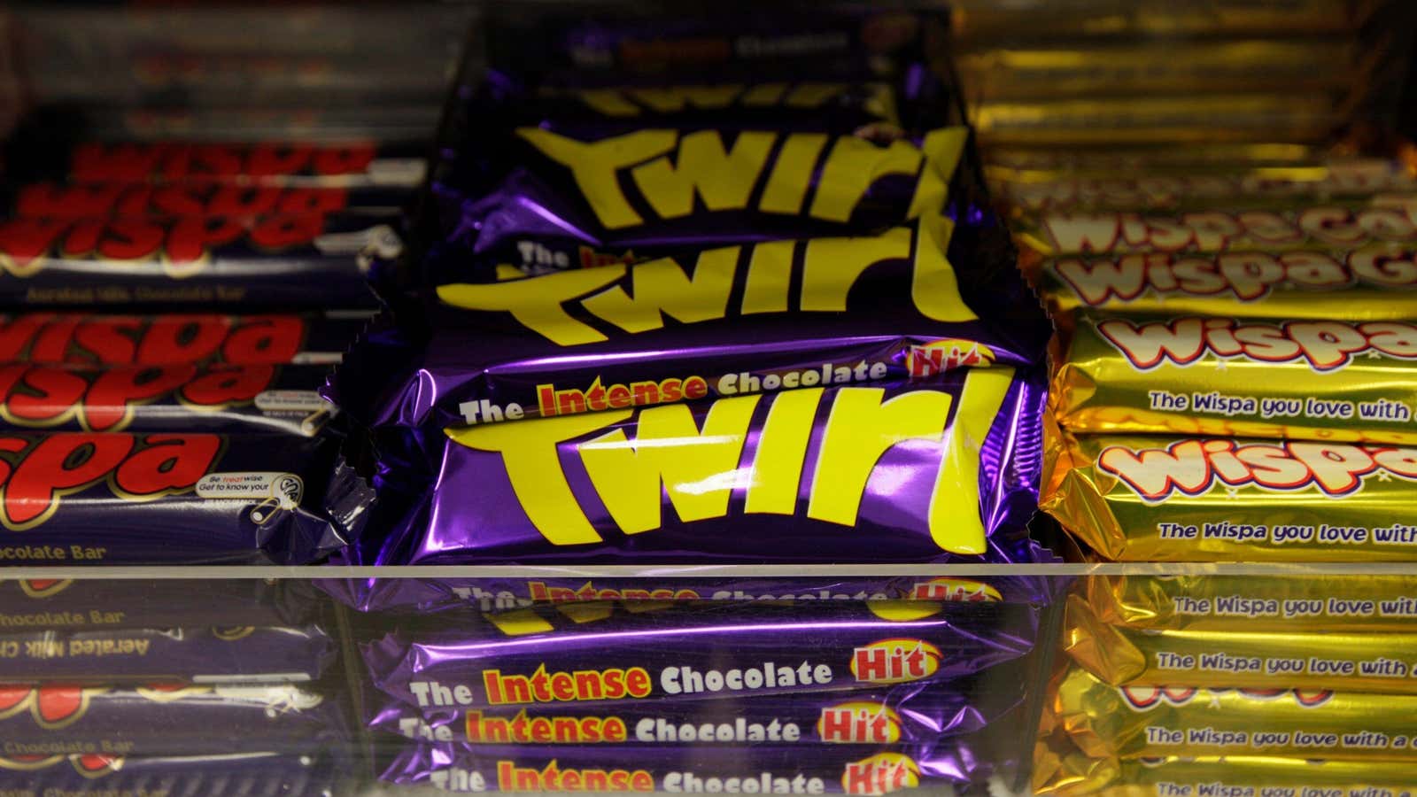 Cadbury chocolate bars are seen on a supermarket’s shelves in central London, Monday Nov. 9, 2009. Kraft Foods Inc. has launched a 9.8 billion pound…