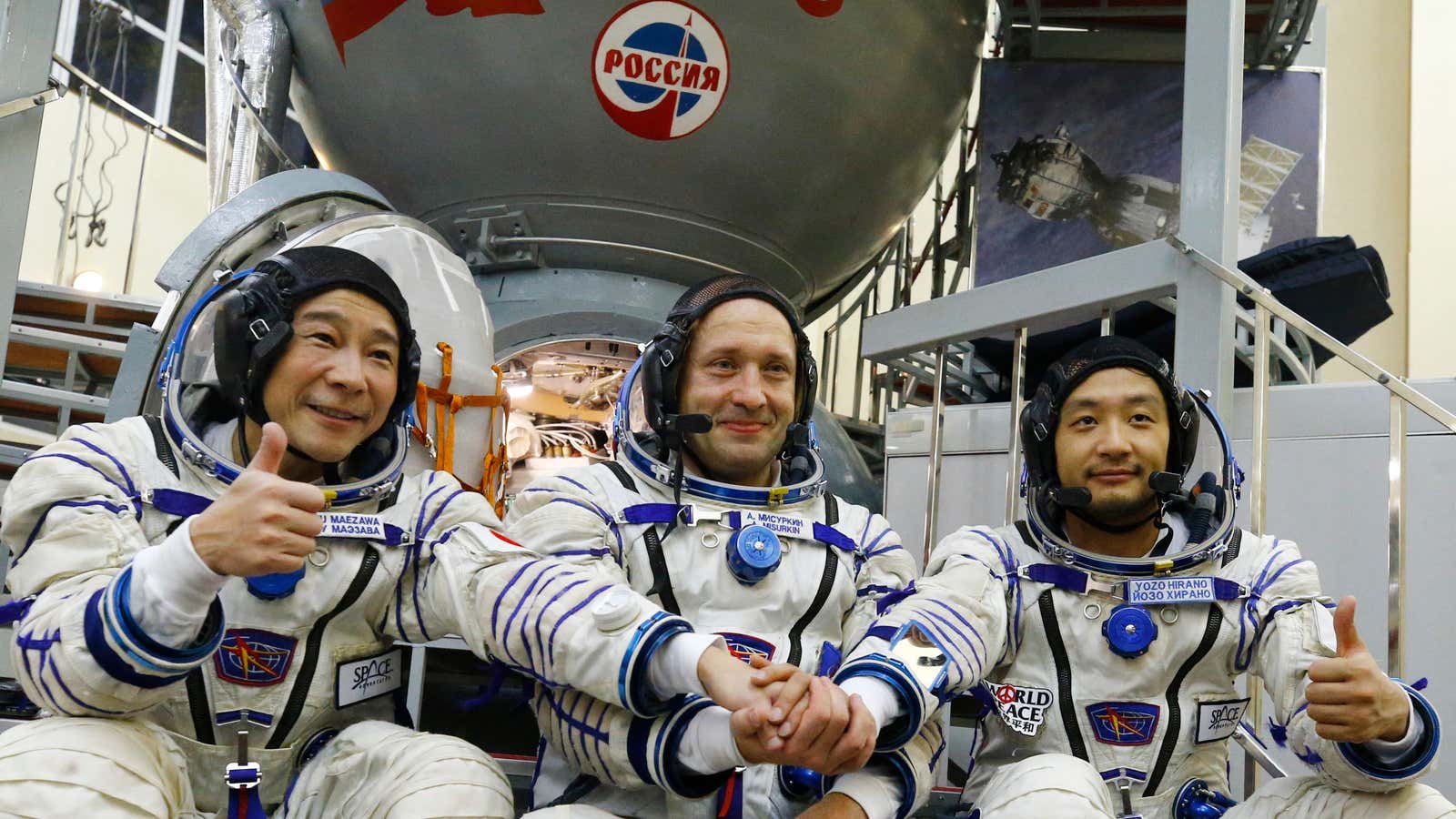 Russian cosmonaut Alexander Misurkin (C) and space flight participants - Japanese billionaire Yusaku Maezawa (L) and his assistant Yozo Hirano - attend a training ahead of the expedition to the International Space Station, in Star City outside Moscow on October 14, 2021.Â 