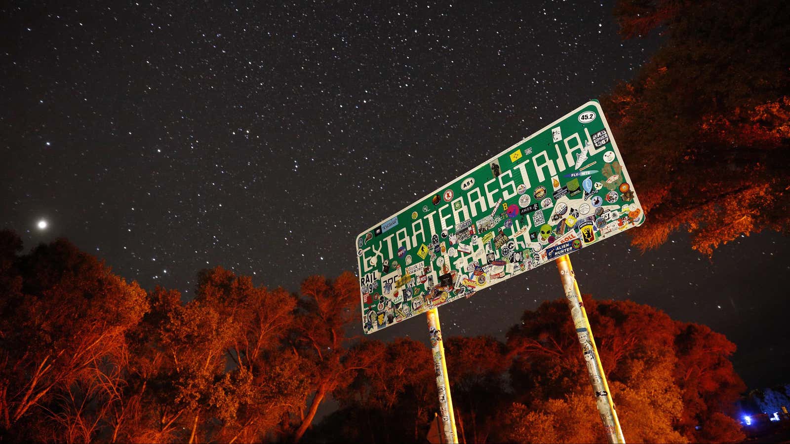 FILE – In this July 22, 2019 file photo, a sign advertises state route 375 as the Extraterrestrial Highway, in Crystal Springs, Nev., on the way to Nevada Test and Training Range near Area 51. A second rural Nevada county prepared Thursday for a “Storm Area 51” event that began as an internet joke but has drawn millions of social media fans. Organizers of the event hope people will gather and try to make their way into the once top-secret U.S. Air Force test area known in popular lore as a site for government studies of outer space aliens. An emergency declaration for Nye County took effect a day after county disaster preparation and sheriff officials told county lawmakers they’re unsure how many — or where — people might show up for events Sept. 20-22. (AP Photo/John Locher, File)