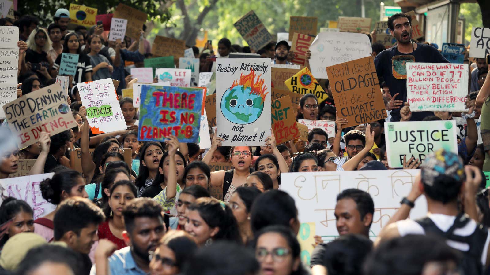 Students and activists hold placards with messages as they participate in a Global Climate Strike rally in New Delhi, India, September 20, 2019.