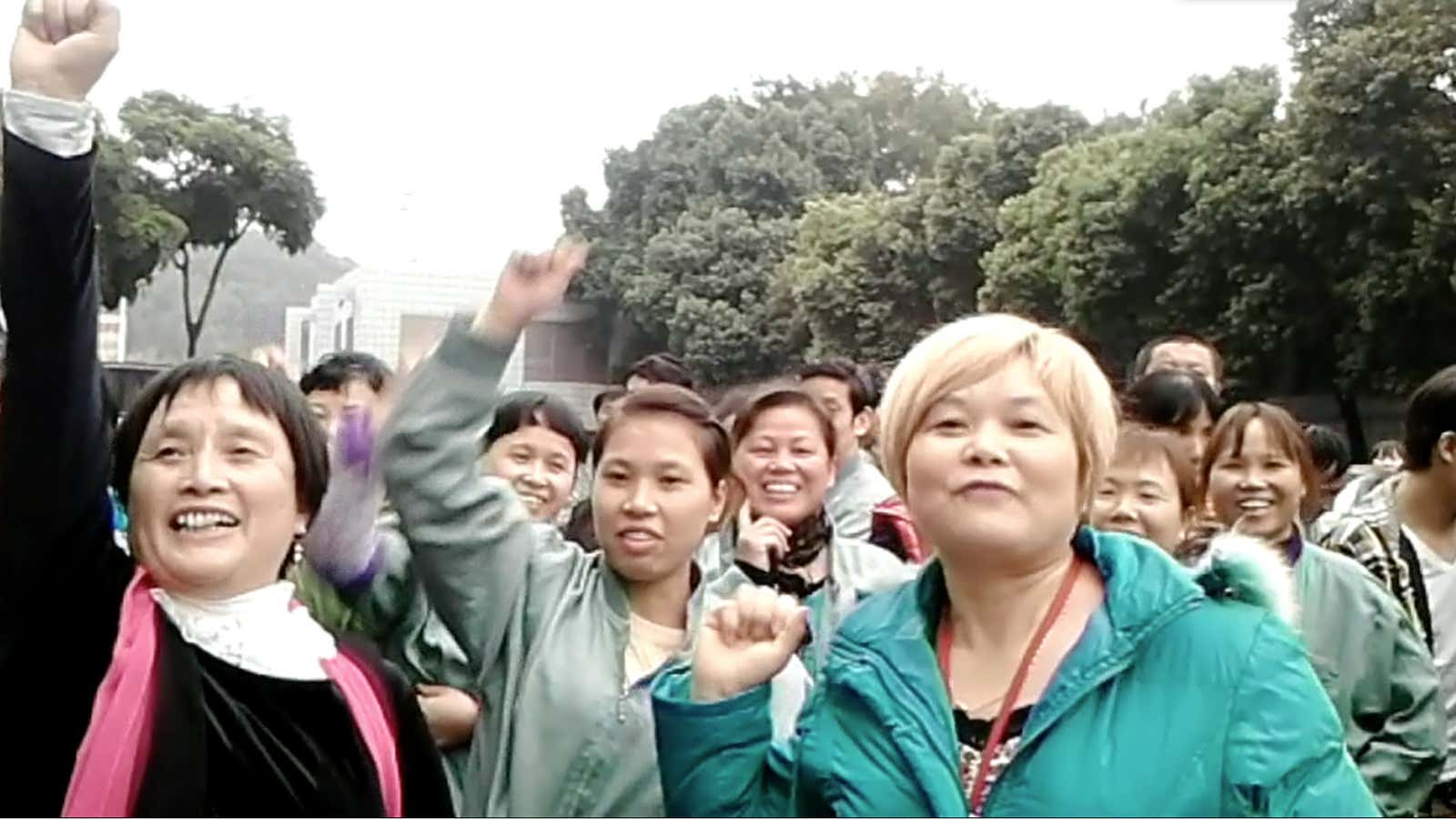 Workers at the Lide Shoe Factory shout “give us back our hard-earned money” during a Dec. 2014 strike.