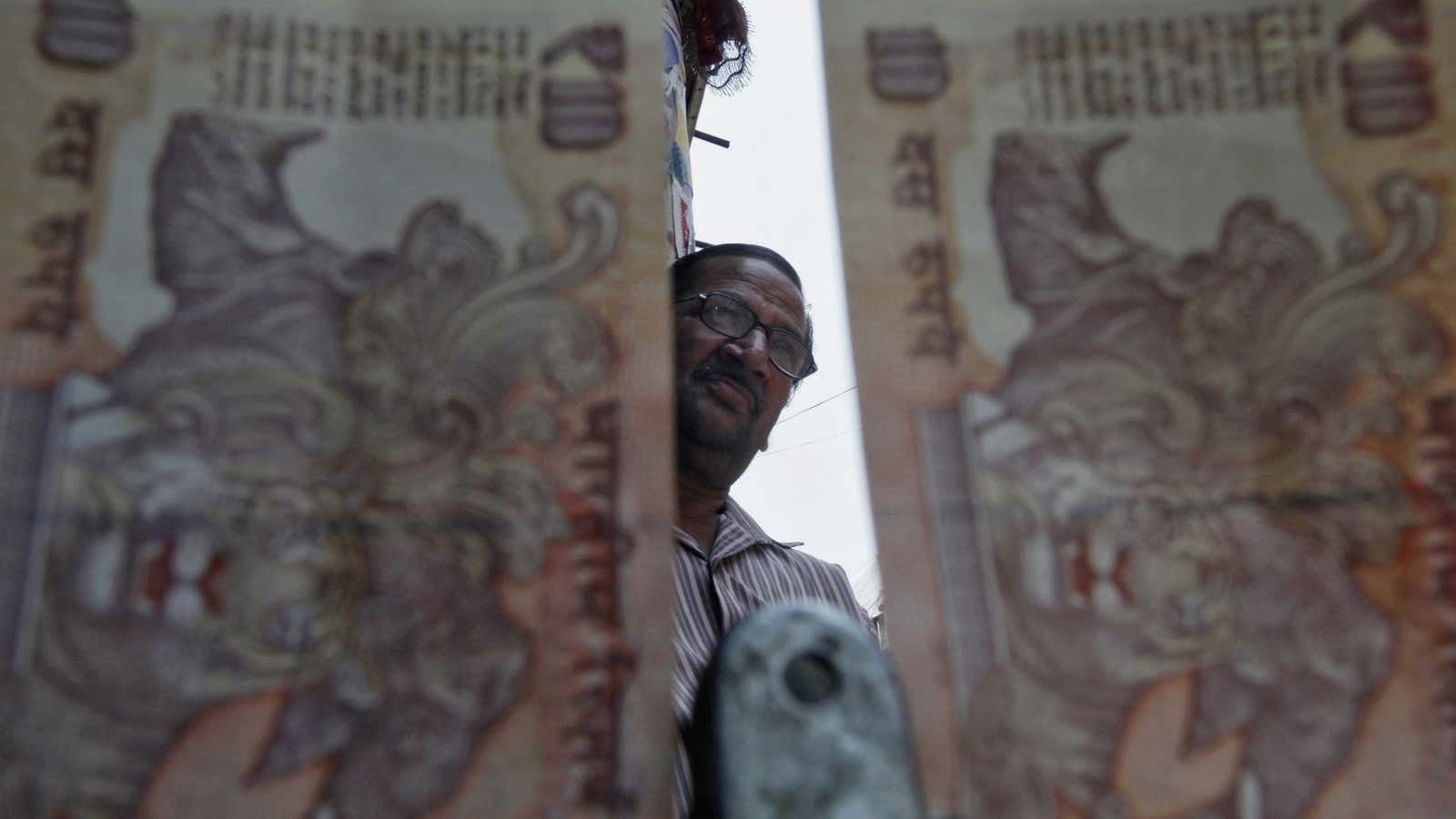 For money changers in Delhi, the weak rupee looms large.