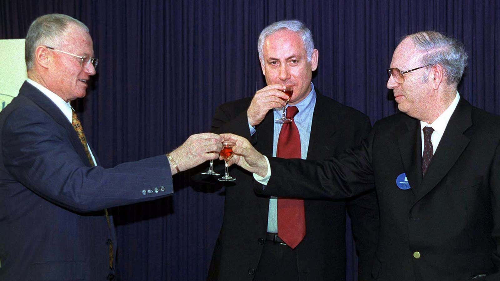 Efraim Halevy (R) toasts his Mossad predecessor, Danny Yatom (L), along with Israeli prime minister Benjamin Netanyahu.