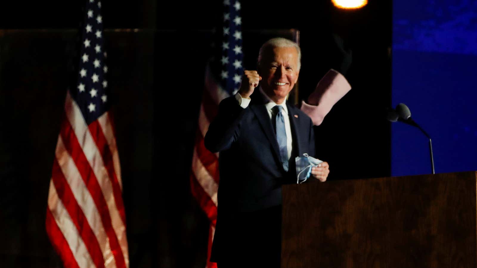 U.S. Democratic presidential nominee and former Vice President Joe Biden raises a fist as he delivers remarks after early results from the 2020 U.S. presidential…