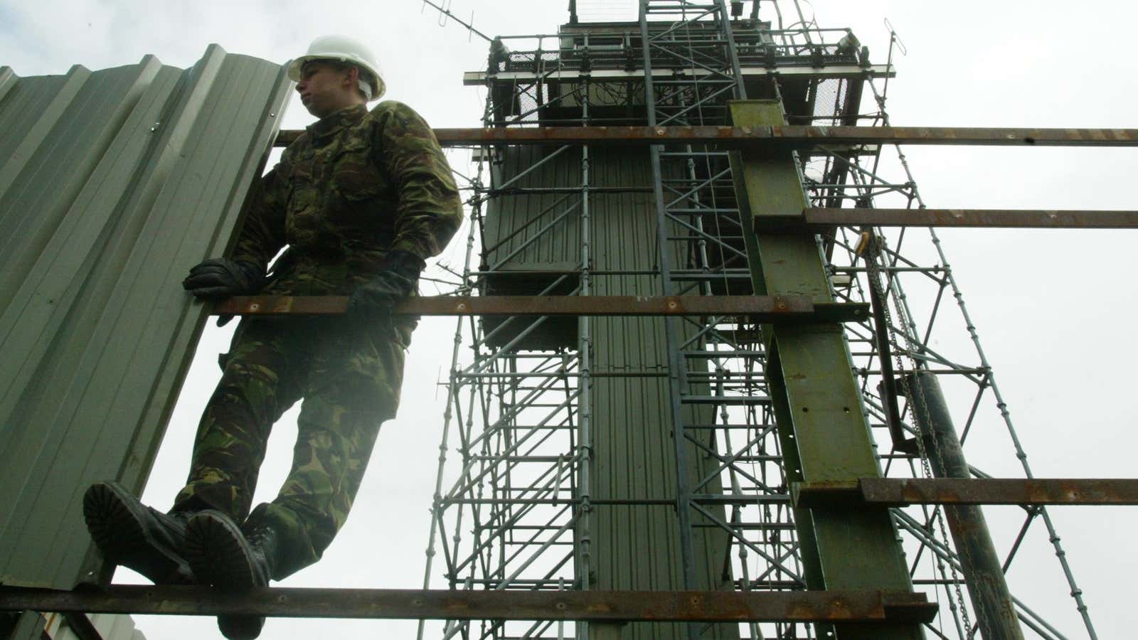 A British army sapper carries out demolition work at the border.