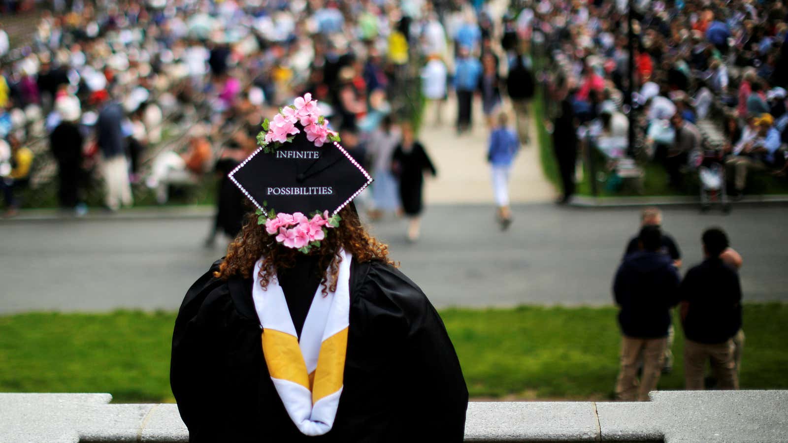 A senior with “Infinite Possibilities” written on her cap waits to graduate during Commencement at Smith College in Northampton, Massachusetts, U.S., May 21, 2017
