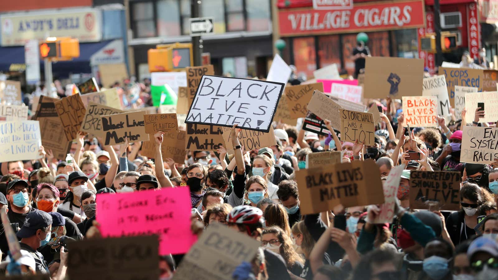 Protesters hold placards as they rally against the death in Minneapolis police custody of George Floyd, in the Manhattan borough of New York City, U.S., June 2, 2020.