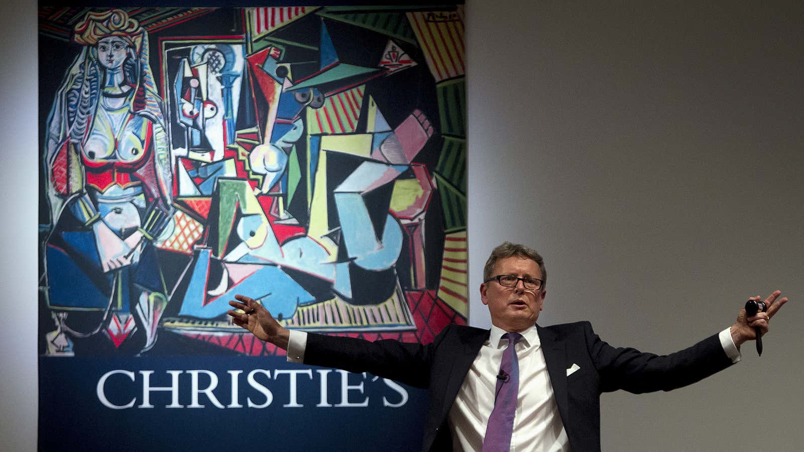 Auctioneer Jussi Pylkkanen calls for final bids before dropping the gavel as he sells Pablo Picasso’s “Les femmes d’Alger (Version ‘O’)” (Women of Algiers) at Christie’s.