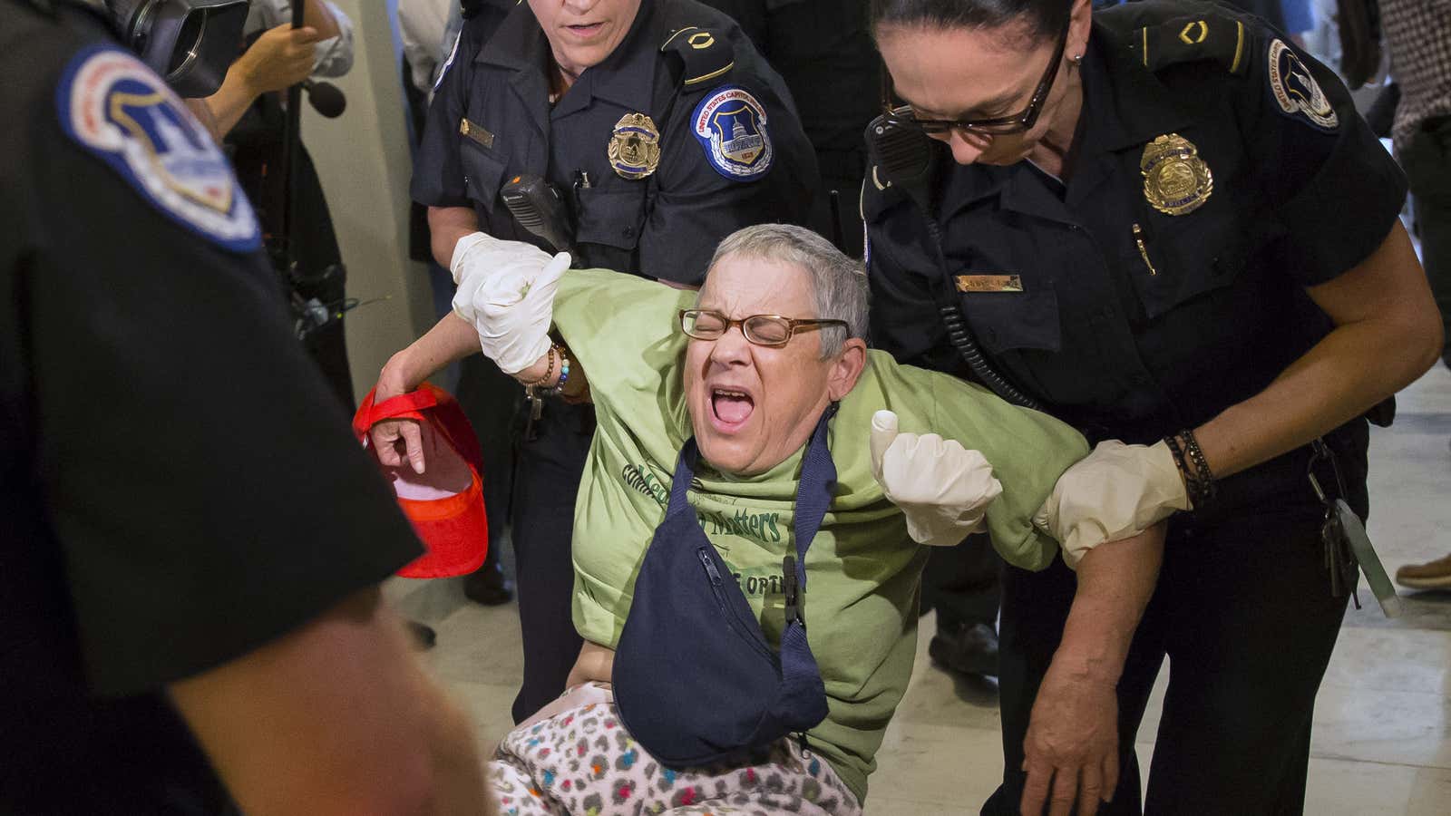 A protestor is carried away from Senate majority leader Mitch McConnell’s office on June 22.