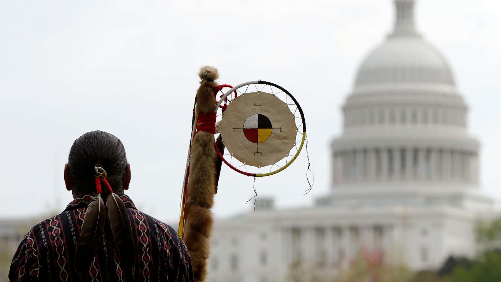 Matthew Black Eagle Man of the Sioux Long Plains First Nation of Manitoba protests in front of the U.S. Capitol, against the Keystone XL pipeline in April 2014. (Reuters/Gary Cameron)