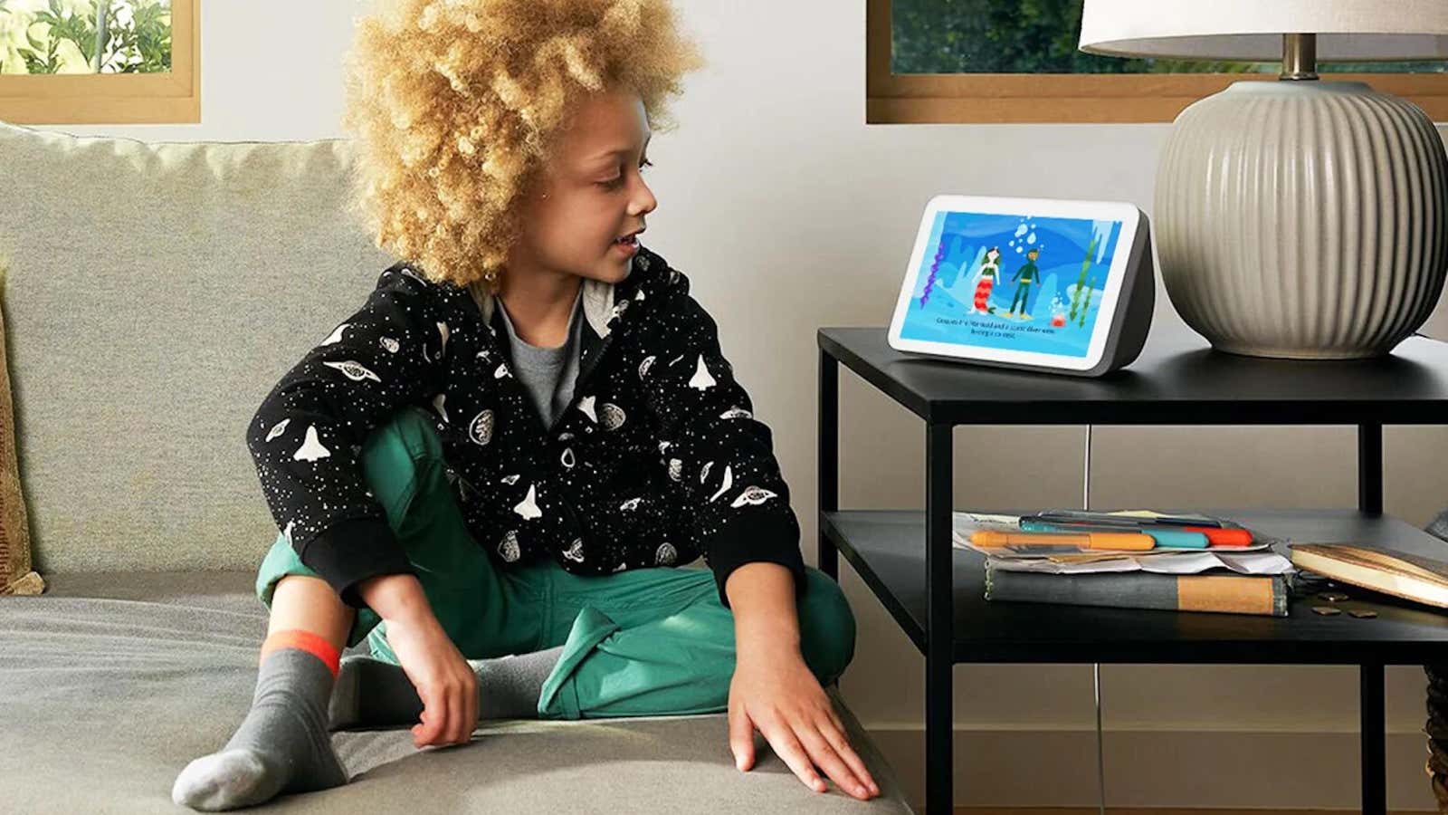 A child interacts with Amazon&#39;s Echo Show. 