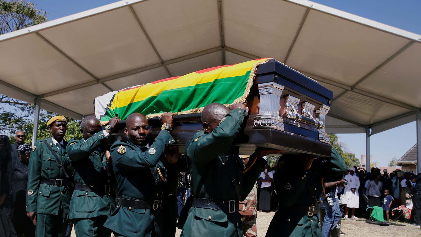 A coffin containing the body of former Zimbabwean President Robert Mugabe arrives at his rural village in Kutama, Zimbabwe, September 28, 2019.