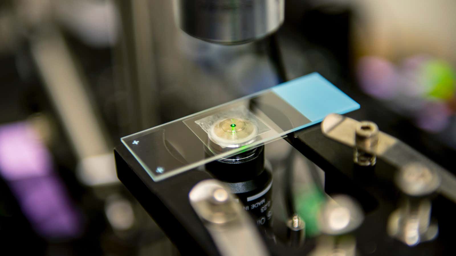 As they’re laser cooled, nanocrystals emit a reddish-green glow.
