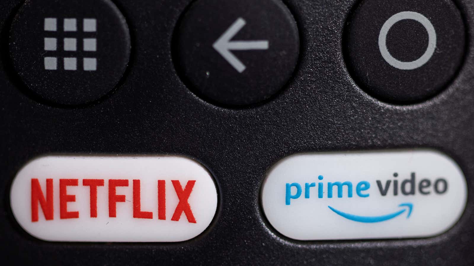 The logos for Netflix and Amazon Prime Video shown on a remote control.