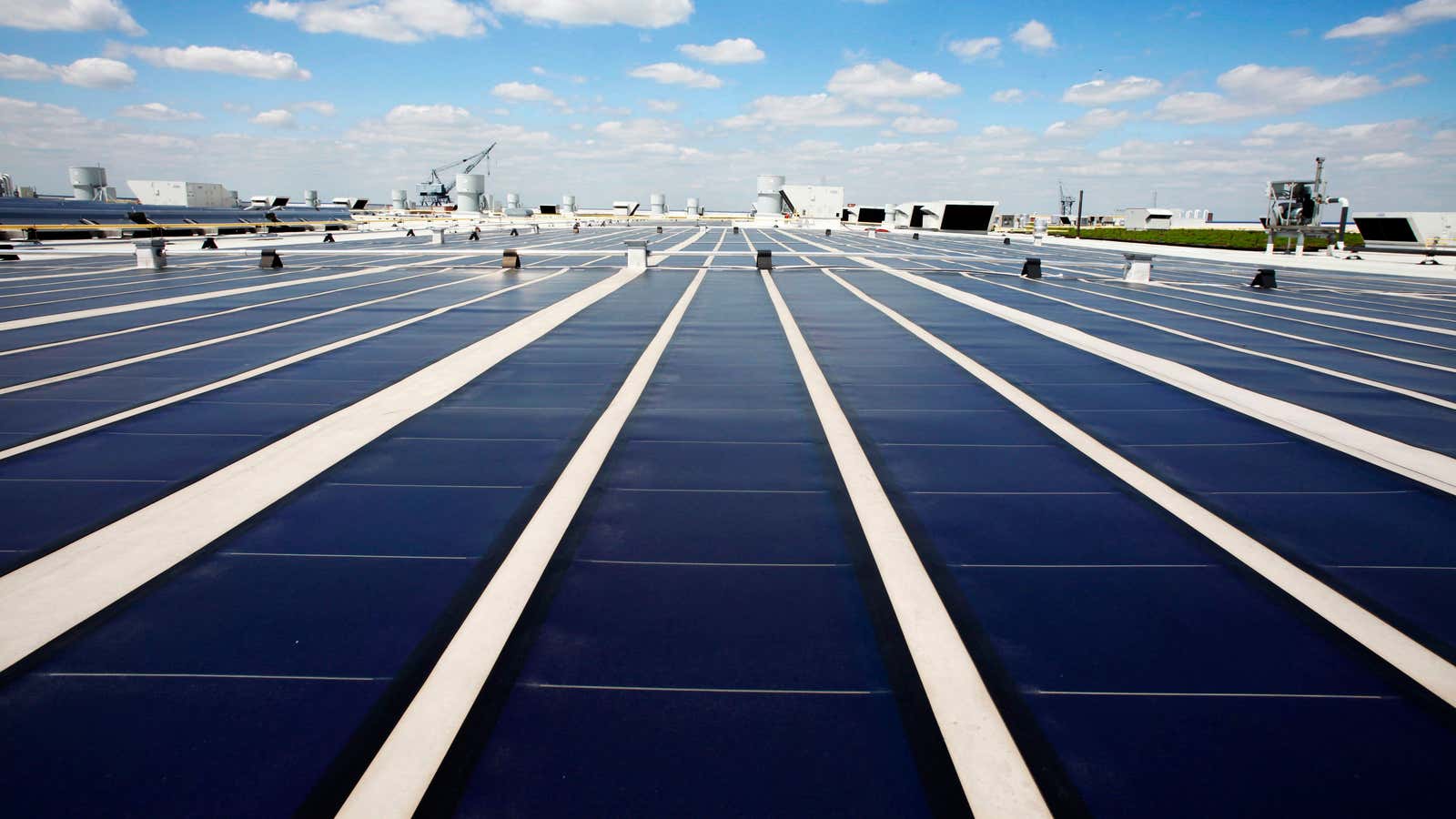 Rooftop solar panels on an IKEA help save costs.