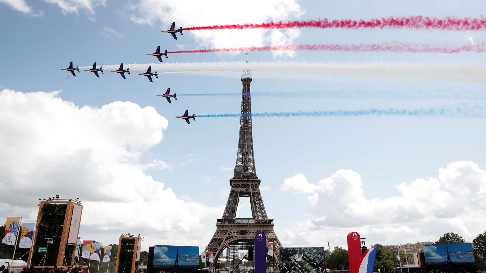 Alpha jets from the French Air Force Patrouille de France fly past Eiffel Tower at Paris’ Olympics fan zone during the closing ceremony of the Tokyo games, at Trocadero Gardens in Paris, France, August 8, 2021.
