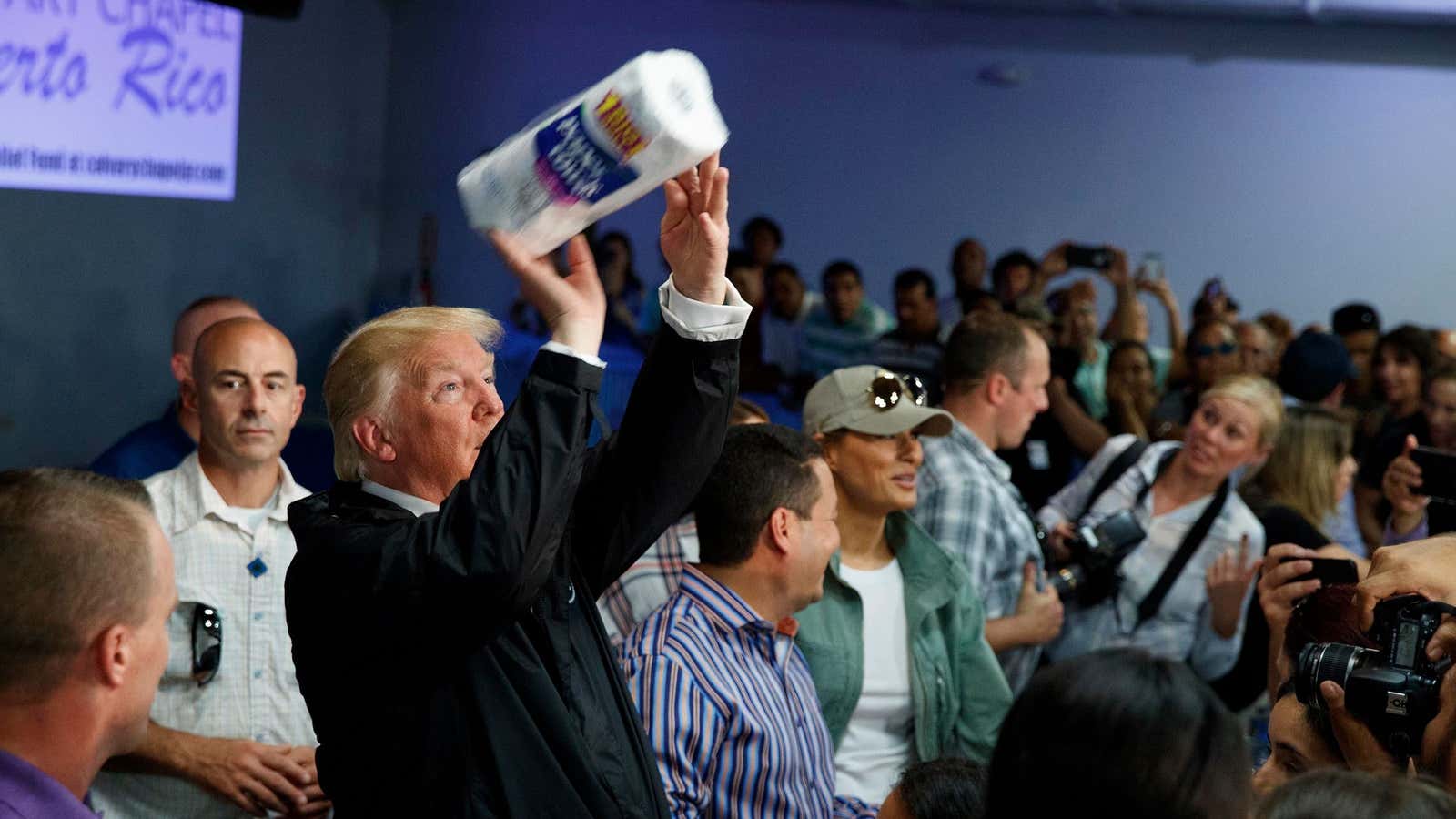 President Donald Trump tosses paper towels into a crowd in Puerto Rico.