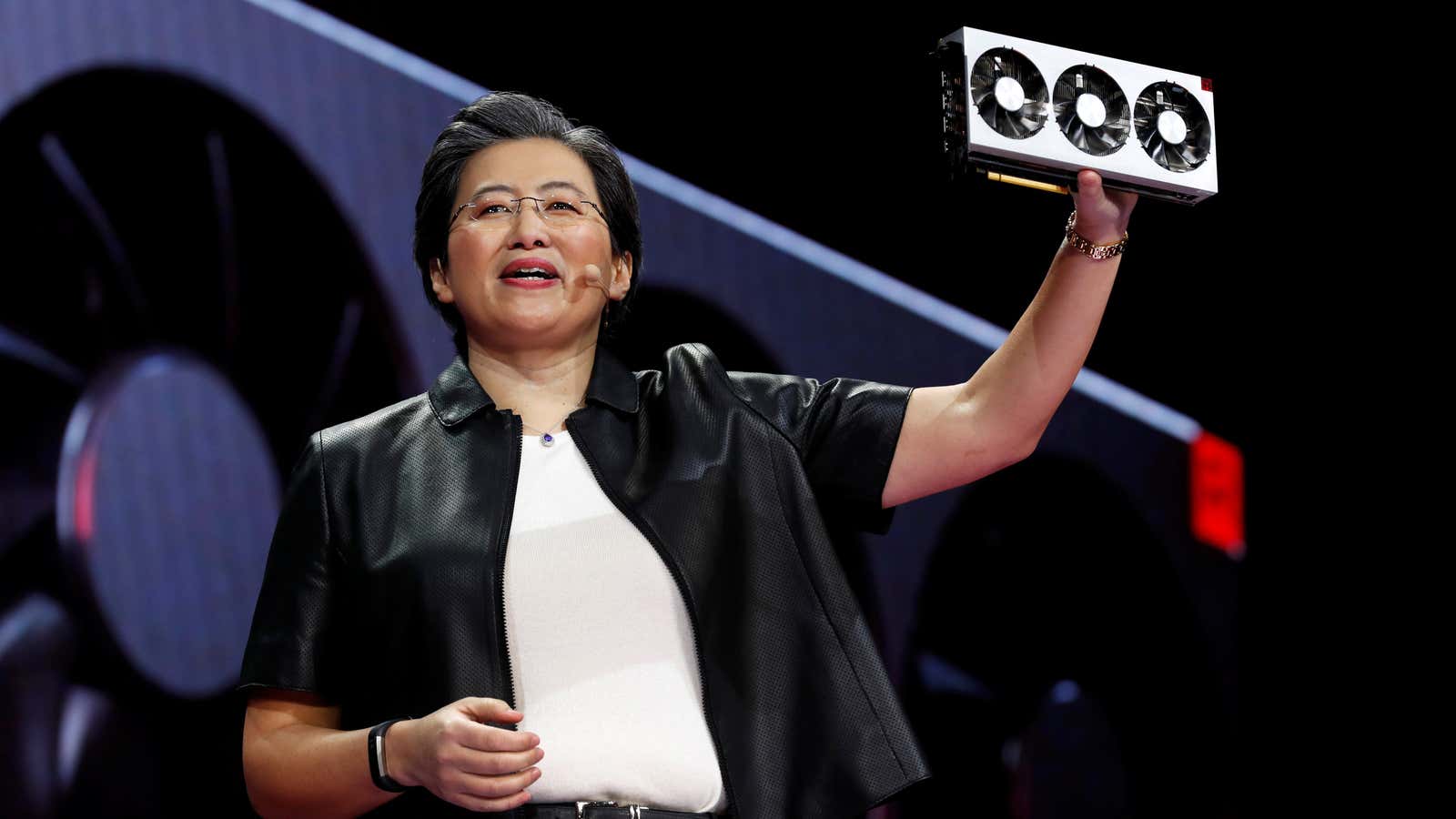 AMD CEO Lisa Su holds up a graphics card—gamers’ holy grail.