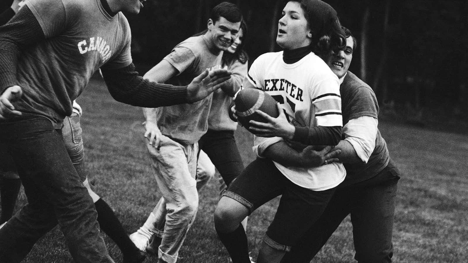A 1965 “battle of the sexes” football game between Vassar and Princeton. In reality, it’s the women who face pressure to find a mate in college—and hang onto him.