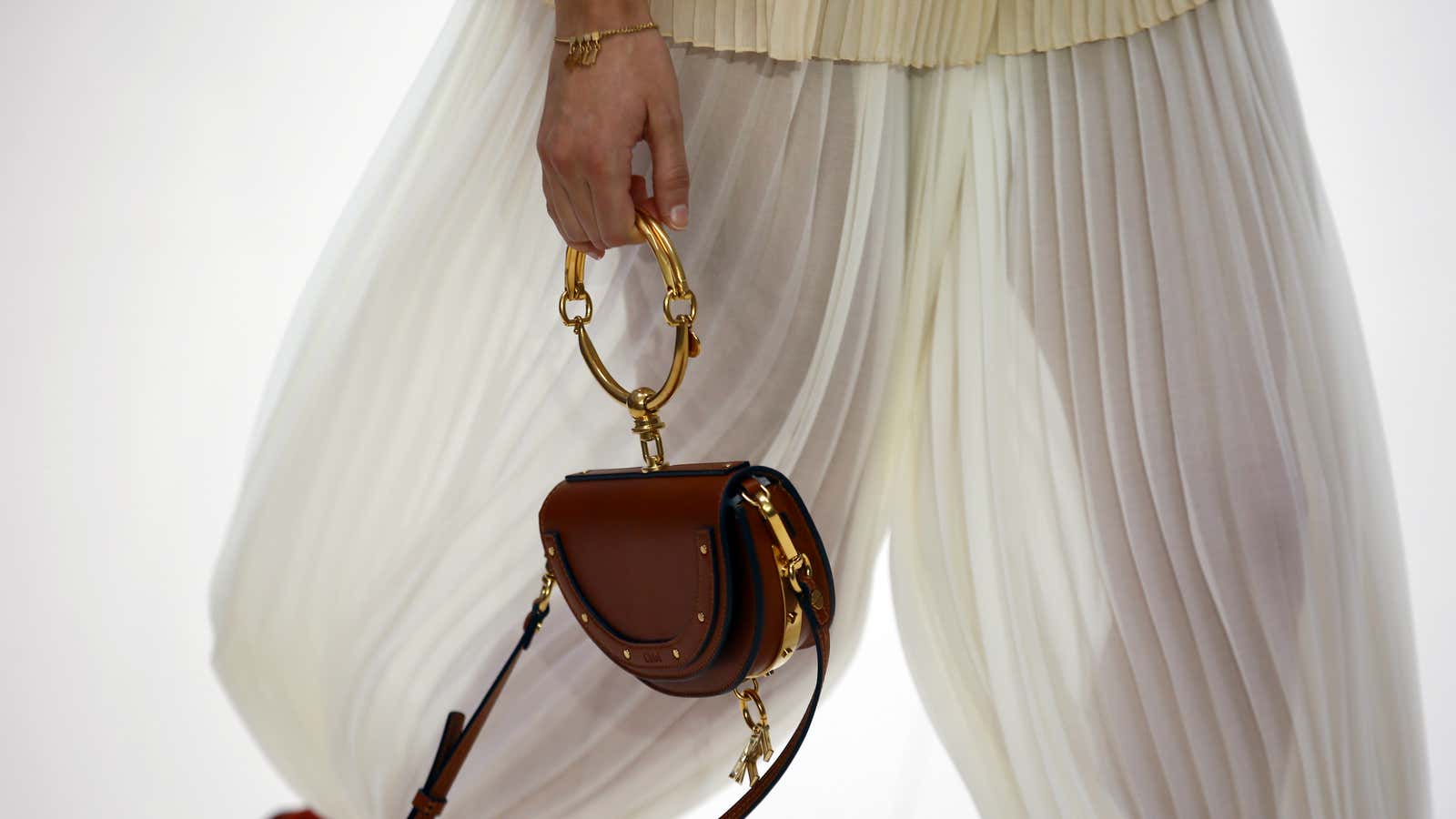 Chloé signatures: High-end handbags and filmy layers.