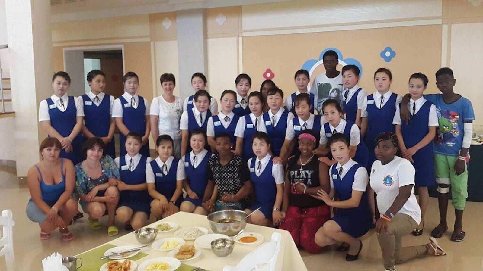 Delegates from Tanzania pose with North Korean students in 2015.