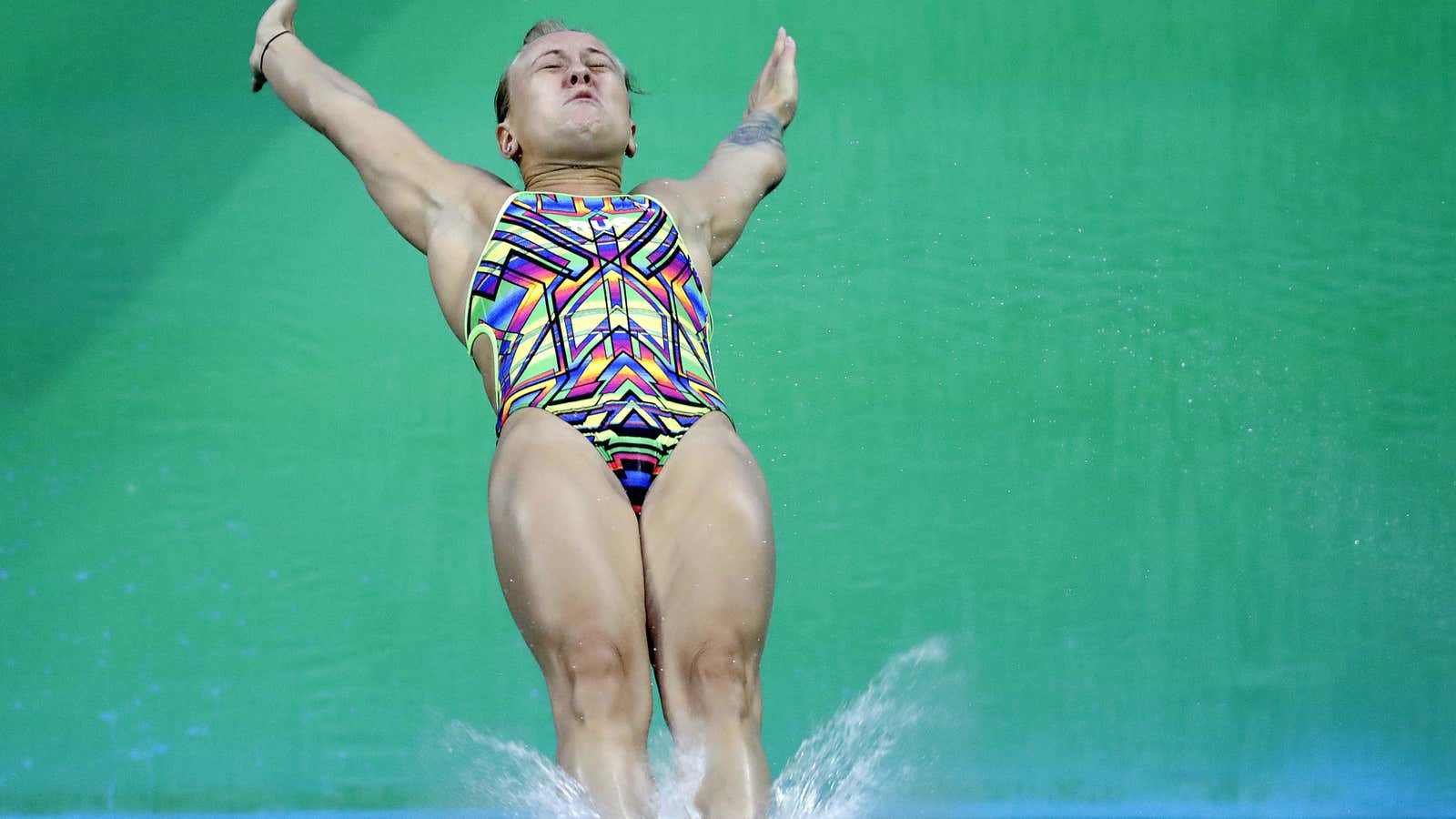 Russia’s Nadezhda Bazhina back flops in to the water during the women’s 3-meter springboard diving preliminary round.