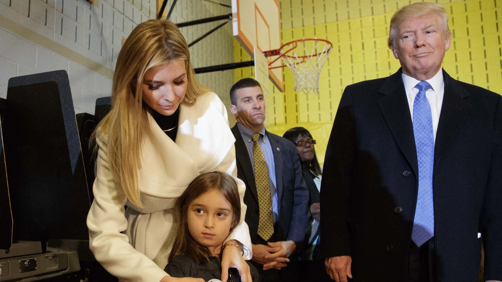 Republican presidential candidate Donald Trump watches as his daughter Ivanka puts an “I Voted” sticker on her daughter Arabella, after casting their ballots at PS-59,…