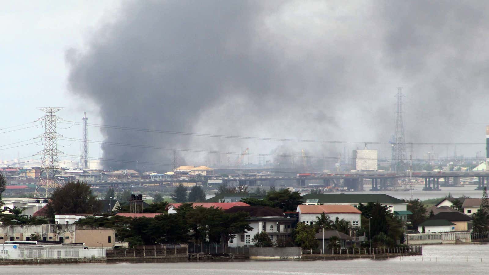 Smoke rises from Lagos mainland, Nigeria, Oct. 21, 2020 after building are set alight in response to security shooting of protesters on Oct. 20.