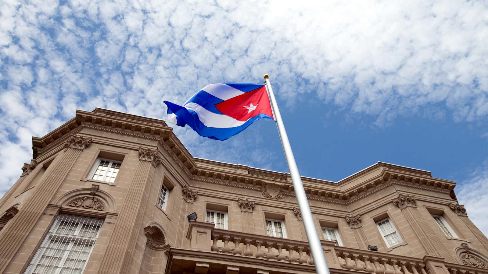 The Cuban flag flies above its US embassy for the first time since 1961.