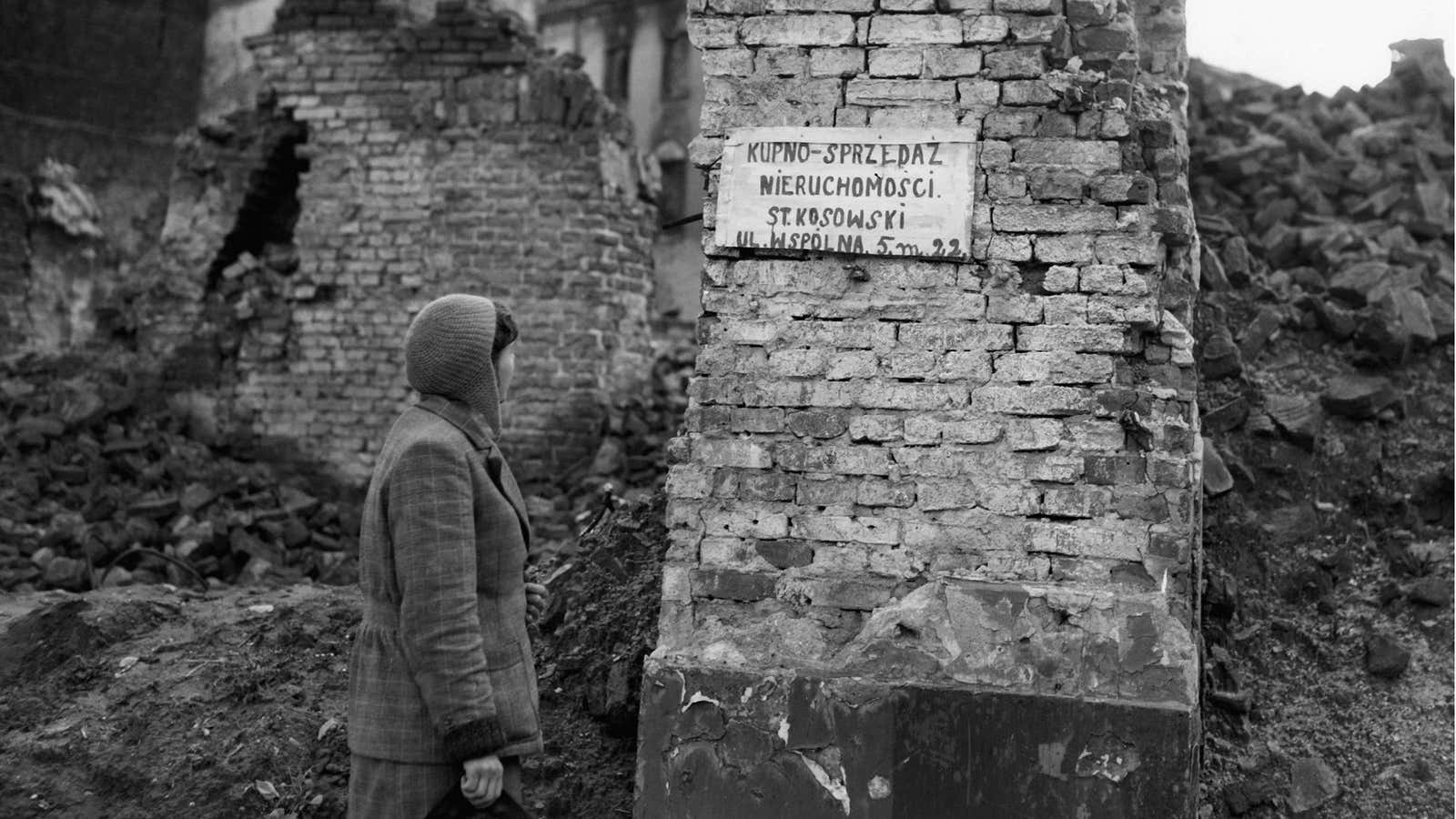 Even in the rubble of WW2-shattered Warsaw, signs popped up for small businesses looking to buy and sell furniture and other goods. Oct. 13, 1945.