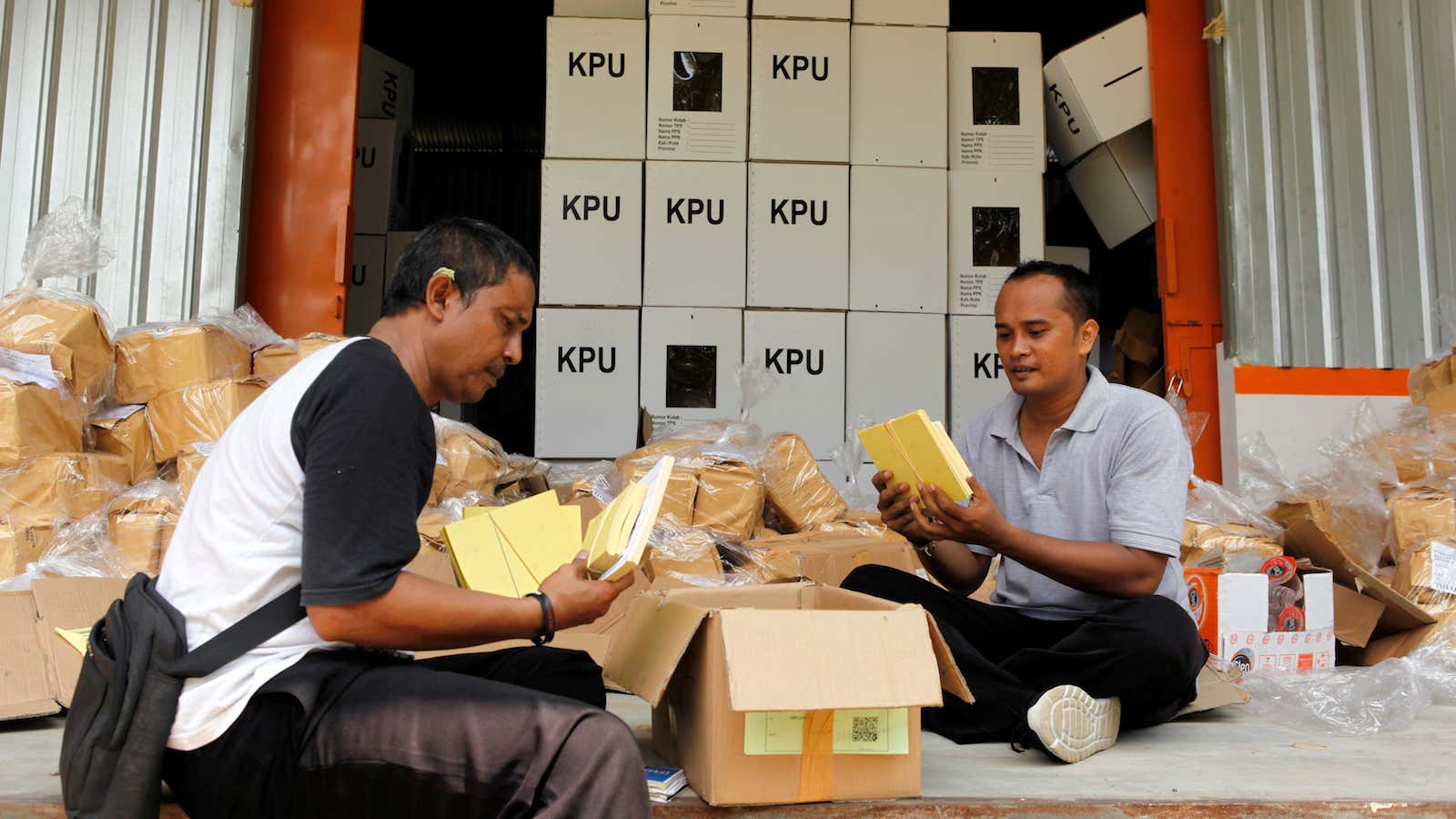 Indonesian government employees prepare ballot papers for 150 million voters.