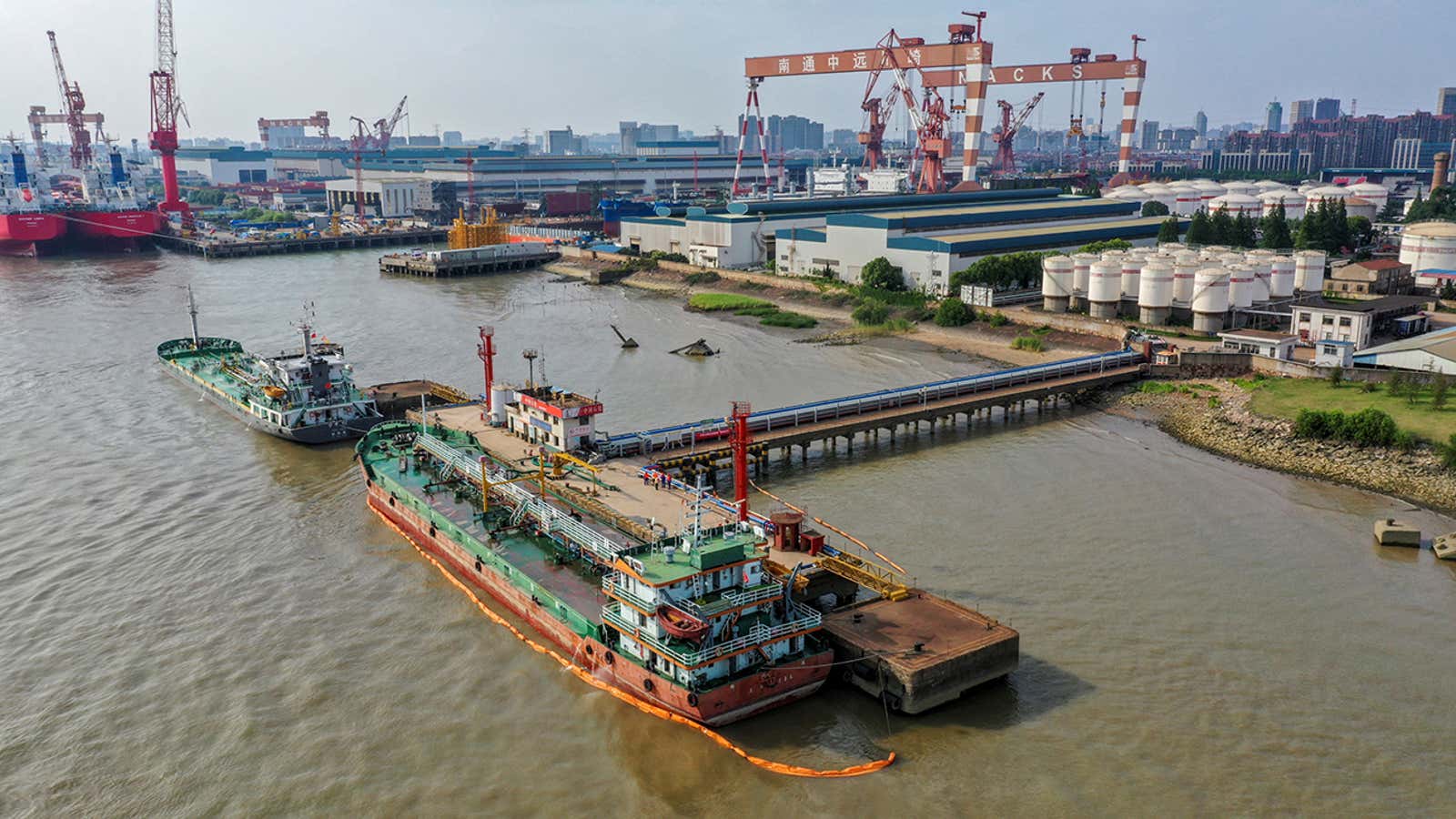 FILE PHOTO: Oil tankers are seen at a terminal of Sinopec Yaogang oil depot in Nantong, Jiangsu province, China June 11, 2019. Picture taken June 11, 2019. REUTERS/Stringer  ATTENTION EDITORS – THIS IMAGE WAS PROVIDED BY A THIRD PARTY. CHINA OUT./File Photo
