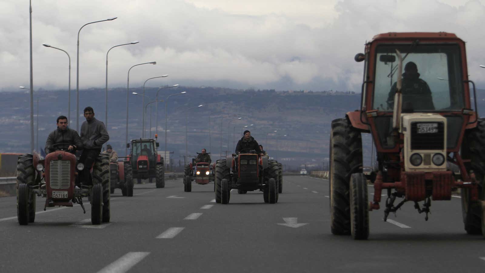 Farmers drive their tractors on Egnatia highway near the northern Greek city of Veria.