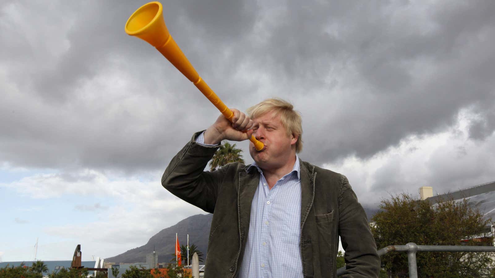 Boris Johnson blows a vuvuzela during his a visit as London mayor to Cape Town in 2010.