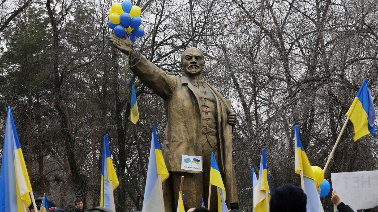 Protestors gather in support of Ukraine near a Lenin statue in Almaty, Kazakhstan
