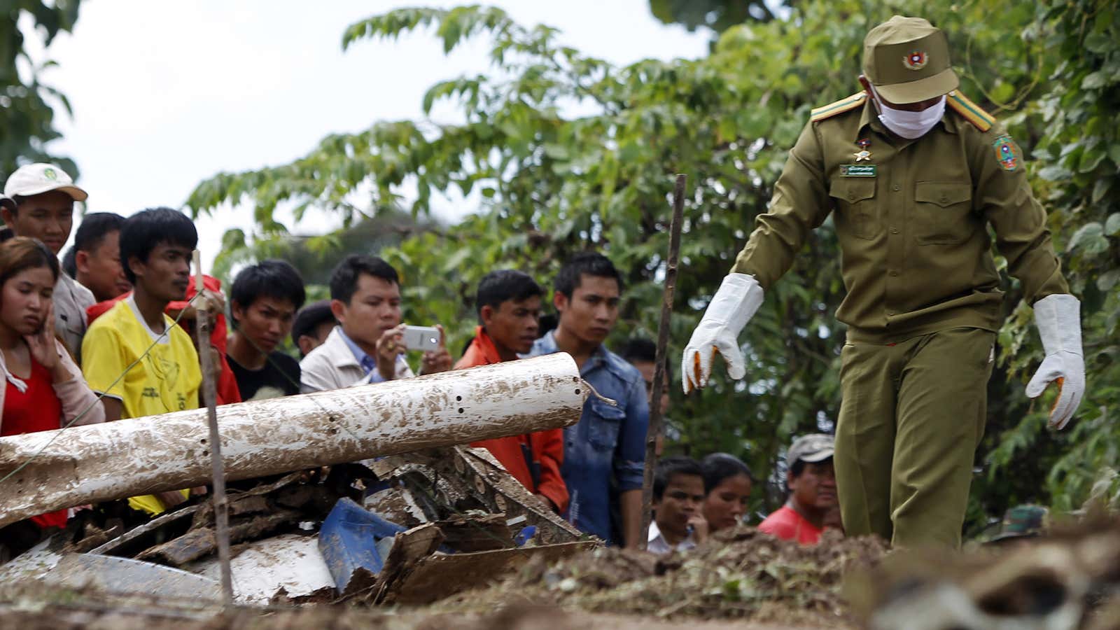 Villagers and rescue personnel near Pakse, Laos.