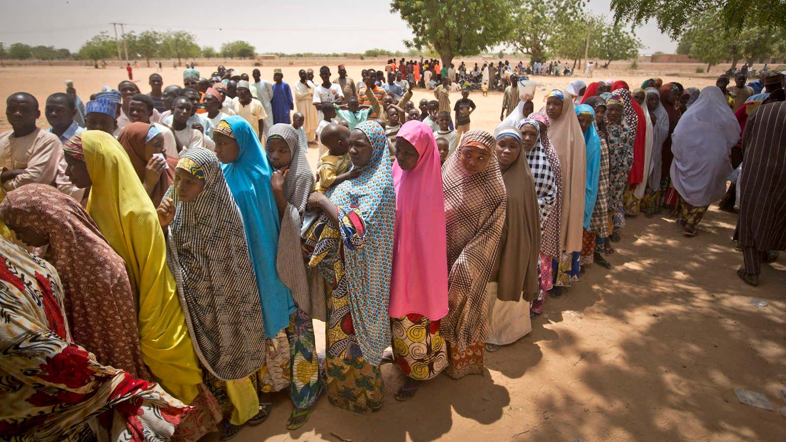 Women voters stood in line in the hot sun.