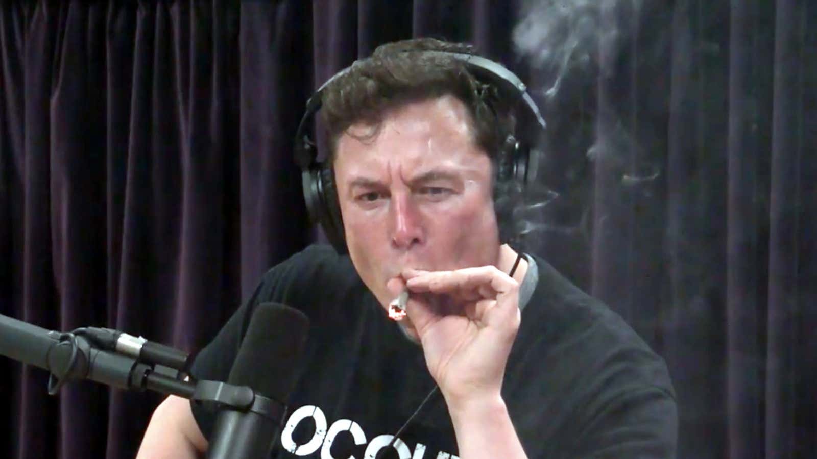 Elon Musk smokes a blunt during an interview with Joe Rogan.