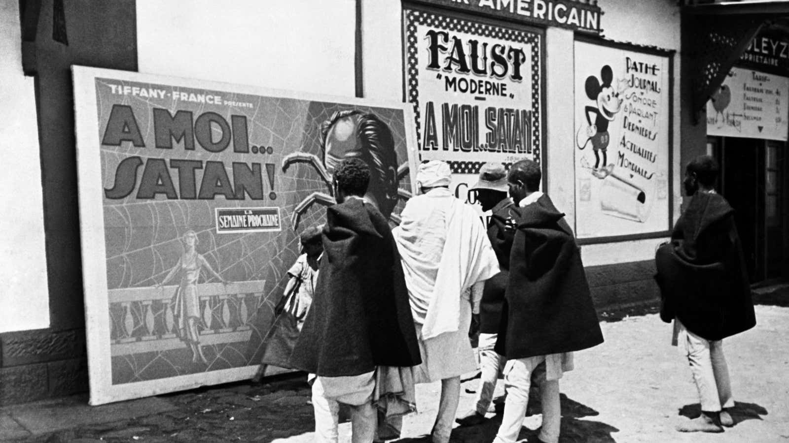 Young people studying posters advertising a cinema in Addis Ababa in 1935.