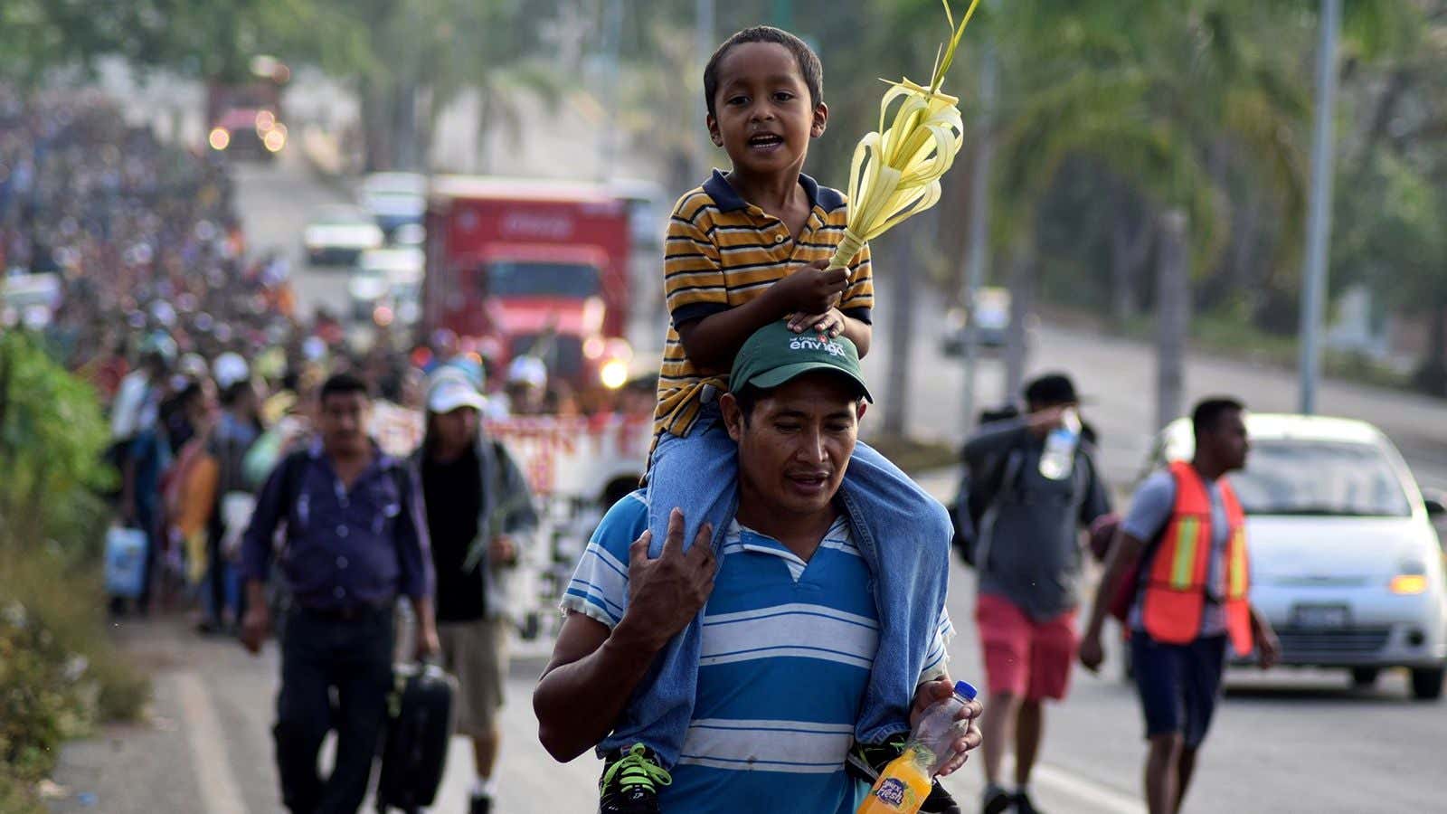 Central American migrants walking north on Palm Sunday, March 25.