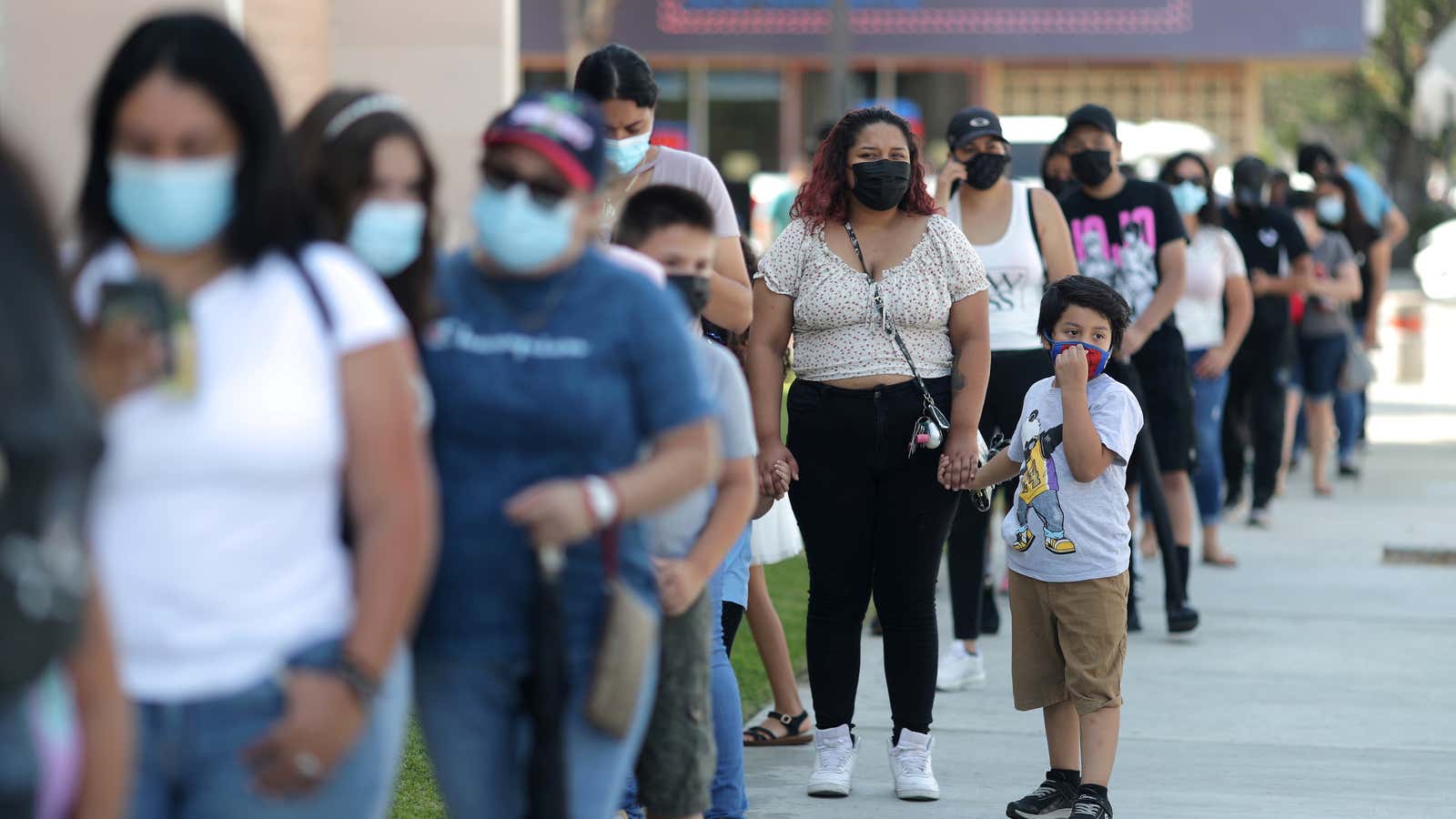 People wait in line for a coronavirus disease (COVID-19) test at a back-to-school clinic in South Gate, Los Angeles, California, U.S., August 12, 2021.