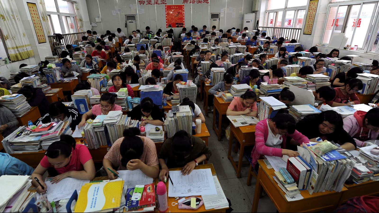 Students prepare for the university entrance exam in a classroom in Hefei, Anhui Province June 2, 2012. The National College Entrance Exam, or “Gaokao”, is…