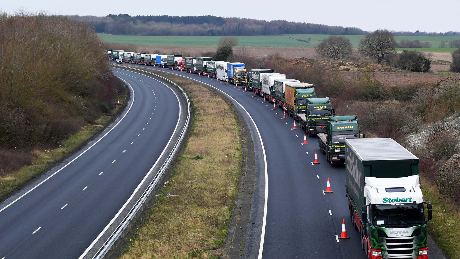 A line of lorries is seen during a trial between disused Manston Airport and the Port of Dover on Jan. 7